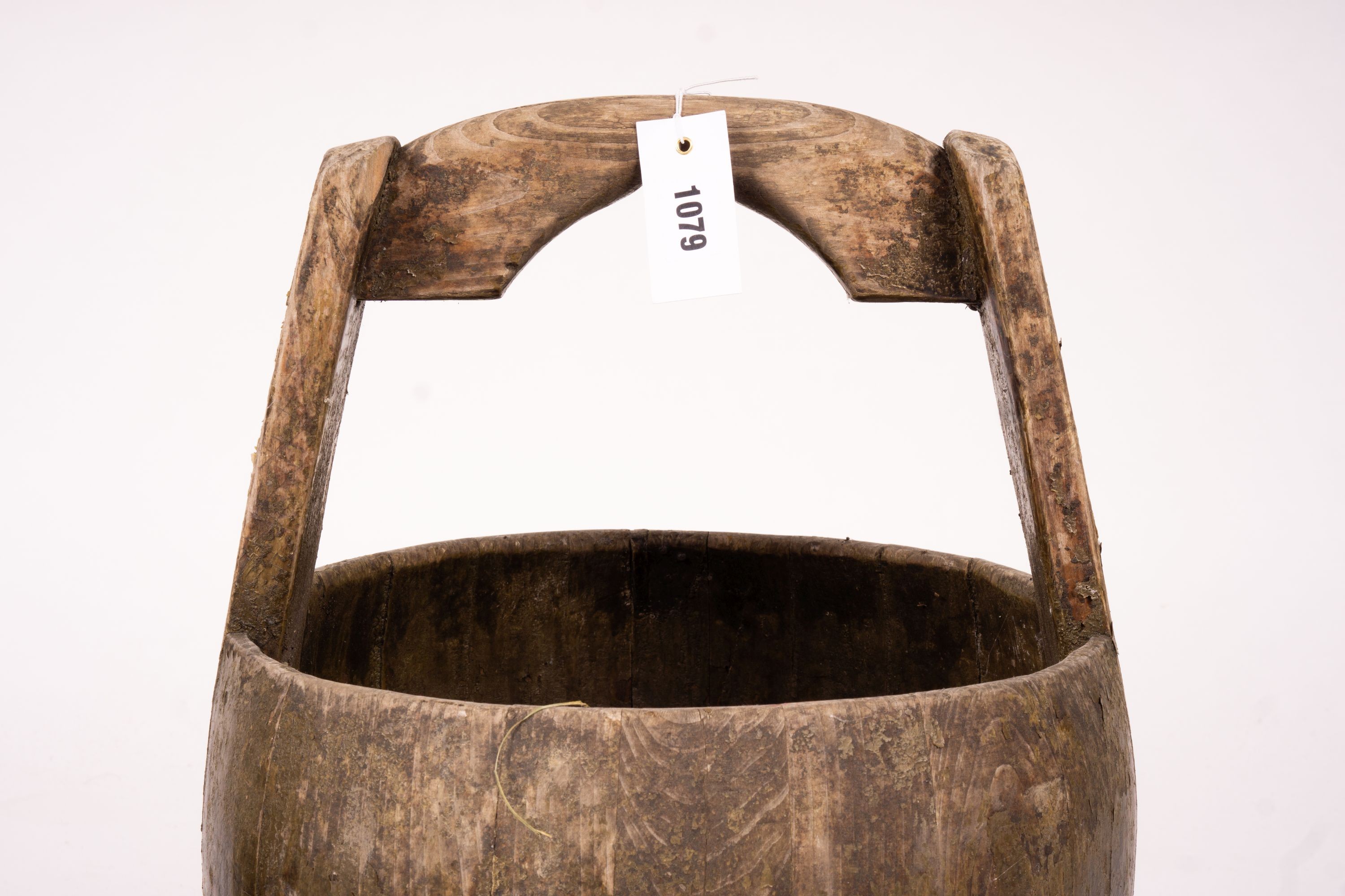 A Chinese staved wood rice carrier together with a circular iron bound staved wood bucket, larger 35cm diameter, height 52cm